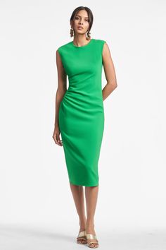 The Diana Dress is a timeless, effortless and chic piece sure to enhance any wardrobe with a pop of kelly green. Crafted with comfort in mind in a thick stretch crepe, her elegant design offers effortless transitions from work to evening events and even weddings. Make dressing up easy - and look beautiful doing it.Details:Model is 5'10" wearing size 242" LongSide ZipperThick Stretch Crepe 92% Polyester - 8% Polyurethane ImportedStyle #R231D11-325 Elegant Green Evening Midi Dress, Elegant Green Midi Evening Dress, Elegant Kelly Green Spring Dresses, Elegant Kelly Green Dresses For Spring, Elegant Kelly Green Fitted Dresses, Elegant Fitted Kelly Green Dress, Green Sheath Midi Dress For Cocktail, Green Sheath Cocktail Midi Dress, Classic Green Midi Dress For Evening