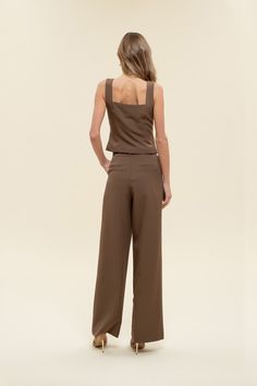 Office chic to date night to weekends looking cutie while on-the go, dress to impress in our Greenwich pleat trousers. These high-waisted pants feature a hook and eye closure, belt loops, back pockets, slick side pockets, pleated detailing, a wide leg with a flared hemline, and let's not forget they are the color of the season - chocolate BROWN! Designed in the USA. Imported Fabric Content: 88% Polyester, 12% Spandex. Inner Lining: 100% Polyester Model is 5'6 and is wearing a size Small. Elegant Belted Solid Wide Leg Pants, Elegant Solid Color Belted Wide Leg Pants, Belted Bottoms For Date Night, Chic Belted Bottoms For Date Night, Solid Color Straight Pants For Date Night, Solid Straight Pants For Date Night, Chic Ankle-length Pantsuit For Night Out, Solid High Waist Wide Leg Pants For Date Night, Chic Belted High-waisted Wide Leg Pants