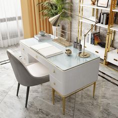 a white desk topped with a computer monitor next to a chair and bookshelf