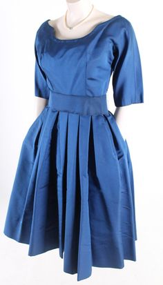 "vintage 1950s dress royal blue silk faille fabric scoop neck fitted waist with belt full circle skirt crinoline underskirt included tagged, Suzy Perette, New York very good vintage condition. minor flaws noticed under close inspection include; stiffening of the belt, some light soiling, belt only. All sales are final, please ask questions before purchasing. Size Small Bust: 34\" Waist: 26\" Length: 43\" Sleeve: 11\" Sweep: 54\"" Blue A-line Vintage Dress For Party, Vintage Party Dresses With Pleated Waist, Elegant Blue Vintage Dress For Vintage Events, 1950s Blue Evening Dress, 1950s Style Blue Formal Dress, 1950s Style Blue Evening Dress, Blue 1950s Style Formal Dress, Blue 1950s Evening Dress, Blue Formal Dress In 1950s Style