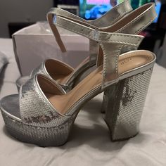 Fashion Nova Dance The Night Away Platform Heels - Silver New Never Used Color Silver/Met Size 7 Need Gone Away Home Party Heels With Heel Strap In Synthetic, Party Heels With Heel Strap In Synthetic Material, Synthetic Heels With Heel Strap For Party, Synthetic Ankle Strap Heels For Party, Night Out Round Toe Block Heels With Wrapped Heel, Block Heels With 4-inch Heel For Night Out, Synthetic Ankle Strap Heels For Party Season, Prom Heels With 4-inch Heel For Party Season, Night Out Closed Toe Block Heels With Wrapped Heel