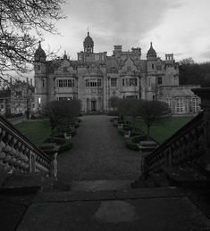 an old building with many windows and balconies on the front, in black and white