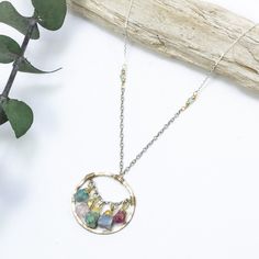 The zinnia necklace adds a rainbow of colors to your look like the zinnia flower adds a rainbow to your garden. Brightly colored rough gemstones dance within a hand forged, gold pendant and are accented with textured chains and tiny beads. •14k gold filled and sterling silver •Apatite, rose quartz, turquoise, chalcedony, and ruby, with blue topaz accent •Pendant is about 1" •Length: 17" Artisan Birthstone Pendant Necklace, Bohemian Birthstone Pendant Jewelry, Bohemian Pendant Necklaces With Birthstone, Multicolor Birthstone Pendant Necklace, Zinnia Flower, Zinnia Flowers, Tiny Beads, Rough Gemstone, Jewelry Repair