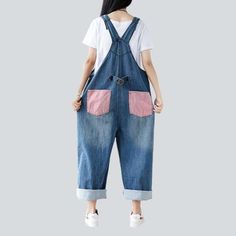 Introducing our 2023 Autumn Collection contrast color women's denim overalls ââ‚?a street style wardrobe staple that promises to make you the talk of the town!Why You'll Fall In LoveThis jumpsuit is the perfect amalgamation of modern fashion sensibilities and Y2K nostalgia. Crafted with love and care. it features a loose. baggy silhouette. intricate painted prints. and a sanded finish for a unique texture. Its vibrant color and delicate suspenders and buttons closure make for an eye-catching ens Denim Blue Bib Front Jumpsuit For Spring, Denim Blue Bib Front Jumpsuits And Rompers For Spring, Casual Dark Wash Bib Front Overalls, Trendy Bib Front Overalls For Spring, Spring Jeans With Contrast Stitching, Contrast Color Cotton Jeans, Trendy Spring Jeans With Contrast Color, Spring Casual Denim Bib Front Jumpsuit, Spring Casual Overalls With Bib Front