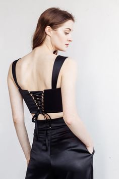 Satin lace-up corset top ANDREA with a square neckline. You can choose corset with lace up or buttons. Just mention this in personalization option. You can wear it with: Oversize jacket: https://www.etsy.com/listing/962180710/jacket-andrea-bridal-suit-city-hall?ga_search_query=jacket&ref=shop_items_search_3&pro=1&frs=1 Palazzo pants: https://www.etsy.com/listing/976154459/satin-pants-andrea-city-hall-wedding?ga_search_query=palazzo&ref=shop_items_search_2&pro=1&frs=1 Crep Bridal Suit, Oversize Jacket, Elegant Suit, Bridal Skirts, Bridal Tops, Crepe Skirts, Bridal Separates, City Hall Wedding, Satin Pants