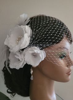 Here is a beautiful set of set of three white flower clips and bandeau birdcage veil. The flowers attached to alligator clips. Ostrich feathers attached to the flower clip. The center of the biggest flower decorated with rhinestone brooch and the smaller flowers decorated with natural  freshwater pearls and rhinestone crystals.  The veil and the flower fascinators are separate pieces. The veiling is white color.  The bandeau veil is attached to the bobby pins. The veiling part is very versatile and can be worn on the front of your head over your eyes or wrapped around the back of your head. There are so many possibilities with this veil. The bigest flower is about  2 3/4" The veil size is 9"  The veil and the flower fascinators also available in ivory  and cream colors. Want to make change Floral Headband For Wedding, Floral Headband Hair Accessories For Wedding, Wedding Fascinator With Flower Decoration, Wedding Headpiece With Flower Decoration, Elegant Wedding Headpiece With Flower Decoration, Elegant Wedding Hair Accessories With Flower Decoration, Handmade Flower Fascinator For Wedding, Elegant Floral Wedding Headpieces, Elegant Flower Hair Accessories For Wedding