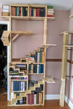 a bookshelf made out of wooden pallets with lots of books on it