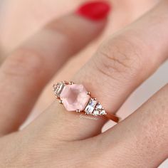 Gorgeous Hexagon Natural Rose Quartz Ring ►Base Metal: Sterling Silver (925) ►Plating: 14K Rose Gold ►Average band width: 1.7 mm. Center Stone: Rose Quartz Color: Pink Gemstone creation: Natural Shape: Hexagon Measurements: 7.0 mm Carat Weight: 1.2 ct. (approx.) Hardness (Mohs hardness scale): 7 Luster: Vitreous ►Healing properties: Lowering stress and tension in the heart, Rose Quartz clears out anger, jealousy, and resentment of others, and allows healing of heart issues and dis-ease associate Rose Quartz Color, Unique Promise Rings, Pink Engagement Ring, Gemstone Engagement Ring, Quartz Engagement Ring, Popular Engagement Rings, Rose Gold Quartz, Cluster Engagement Ring, Rose Quartz Ring