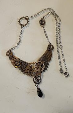 18 inch Brass Steampunk Winged Necklace, Costume Jewelry, Fashion Accessory with Clock Gears This is wonderful find with no visible flaws.  It measures 18 inches in diameter and the pendant is an additional 1.25 inches long.  We have a variety of items for every taste. Combine several of our items together to save on shipping. If you have any questions, please do not hesitate to ask. I also ship internationally. Happy Shopping.  As shop owners we will do our best to describe any issues or problems with our items. Since we do sell vintage and antiques there may be some flaws. Please check out the pictures very carefully and feel free to ask any questions. All sales are final. With any glass items, we price the item to be shipped as soon as reasonably possible with $100 insurance (if the ite Steampunk Wings, Clock Gears, Steampunk Accessories, Assemblage Jewelry, Wing Necklace, Steampunk Jewelry, Costume Jewelry, Pendant Necklaces, Halloween Shopping