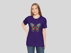 VIBRANT BUTTERFLY T-SHIRT - BOLD AND COLORFUL GRAPHIC TEE Embrace the beauty of nature with our Vibrant Butterfly T-Shirt, featuring an intricately designed butterfly in a stunning array of blue, orange, and red hues. This eye-catching design is perfect for adding a splash of color and style to your wardrobe. WHY YOU'LL LOVE IT This t-shirt isn't just a piece of clothing; it's a wearable piece of art. Whether you're a nature enthusiast, an art lover, or someone who enjoys unique fashion, this butterfly design will captivate and inspire. * Unique Design: A beautifully detailed butterfly with a mix of geometric shapes and flowing lines. * Stunning Artwork: The vibrant butterfly design is a head-turner, meticulously crafted to bring out the beauty of nature in an artistic and modern way. It's Detailed Butterfly, Vibrant Butterfly, Nature Enthusiast, Animal Love, Butterfly T Shirt, Butterfly Shirt, Butterfly Shirts, Butterfly Gifts, Unique Shirt