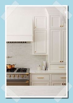 a kitchen with white cabinets and gold knobs on the stove top is featured in this postcard