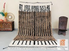 a large rug with black and white designs on it