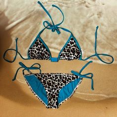 Summery And Colorful Leopard And Turquoise Target Xhilaration String Bikini Top And Swim Bottoms. Triangle Top With Light Padding And Turquoise Metal Adornment. Ties At Neck. Sz S. String Bikini Bottom. Leopard Print And Turquoise. High Cut Thigh. Moderate Bum Coverage. String Side Ties. Bottoms Washed But Never Worn. A Couple Minor Fabric Nits As Shown. Top Was Gently Worn And Laundered. Some Scratches On Metal Adornment And A Few Minor Nits On Fabric As Shown. Both Have Been Stored For A Few Y Turquoise Beachwear Swimwear For Festival, Turquoise Summer Festival Swimwear, Summer Festival Turquoise Swimwear, Stretch Turquoise Swimwear For Beach Season, Turquoise Stretch Swimwear With Triangle Top, Turquoise Triangle Top Stretch Swimwear, Thrift Ideas, Target Bathing Suits, Neon Bikinis