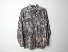 Vintage 90s y2k Camo button down Made by WFS Size Extra Large listed,  Across chest - 23 inches Length - 31 inches Sleeve inseam - 22 inches Good condition! ez70 Camouflage Long Sleeve Shirt For Fall, Long Sleeve Camouflage Shirt For Fall, Fall Camouflage Long Sleeve Shirt, Y2k Camo, Camo Long Sleeve Shirt, Light Wash Camo Hoodie, Vintage Camo Jacket, Camo Long Sleeve, Real Tree Camo