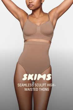 Wear this perfectly stretchy, shapewear high-waisted thong for a flat tummy and cinched waist without bulk or panty lines. Features a high waist fit that hits right below the bust, an interior silicone underband to prevent roll-down, a cotton gusset, and a wide crotch for added coverage. Fits true to size. | SKIMS High-Waisted Thong | Medium Neutral | 2XS | Seamless Sculpt Compressive Shapewear Brief With Built-in Bra, Compressive Shapewear Bottoms With Built-in Bra, Seamless High Stretch Shapewear, Shapewear With Built-in Bra, Seamless Fitted Full Coverage Shapewear, Seamless Full Coverage Fitted Shapewear, Solid High Waist Sculpting Bottoms, High Waist Sculpting Solid Bottoms, Sculpting Shapewear With Built-in Bra