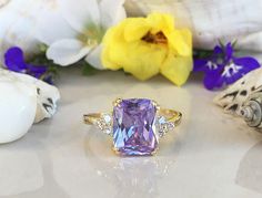 Rectangular Sapphire Promise Ring, Rectangular Sapphire Ring With Prong Setting As Gift, Rectangular Sapphire Wedding Ring, Rectangular Topaz Promise Ring With Accent Stones, Rectangular Amethyst Ring With Accent Stones, Purple Rectangular Stone Ring For Anniversary, Purple Rings With Rectangular Stone For Anniversary, Rectangular Purple Rings With Accent Stones, Purple Rectangular Gemstone Ring