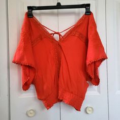 Beautiful, Brand New Boho Top In Size Large Off Shoulder Boho Look Features Batwing Sleeves, Flowers, And Ties Together In The Back. Burnt Orange Or Dark Red Beautiful Color Brand New Cute V-neck Blouse For Vacation, Cute Red V-neck Top, Orange V-neck Top For Festivals, Red Cotton V-neck Crop Top, Cotton V-neck Peasant Top For Vacation, Summer Festival Peasant Top With V-neck, Summer Festival V-neck Peasant Top, Red V-neck Cotton Crop Top, Cute Red Cotton Blouse