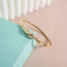 14K Gold Love Knot Bangle, Tie the Knot Bangle, Couple Knot Bracelet, Dainty Couple Bangle, Promise Bracelet, Real Gold Bangle, Gift for Her Material: 14 Carat Gold Approx Weight: 8.06 gr. -10% due to production) Available Colors: Gold, Rose Gold, White Gold Size: 5,5 inches to 8 inches (Contact for custom sizes) Every product is made to order. Celebrate your bond with our 14K Gold Love Knot Bangle, a timeless piece that beautifully symbolizes the unbreakable connection between two souls. This Tie the Knot Bangle features an elegant knot design, making it a perfect symbol of commitment, love, and unity. Crafted from genuine 14 carat gold, this Couple Knot Bracelet is both dainty and durable, offering a touch of sophistication that complements any style. The Dainty Couple Bangle is designed Formal Bangle Bracelet With A Modern Twist, Elegant Hinged Gold Bracelet As Gift, Elegant Hinged Gold Bracelet For Gift, Elegant Hinged Gold Bracelet Gift, Formal Bangle With Modern Twist, Elegant Hinged Bracelets As Gift, Elegant Hinged Bracelet As A Gift, Elegant Hinged Bracelet For Gift, Flexible Yellow Gold Bracelet For Wedding