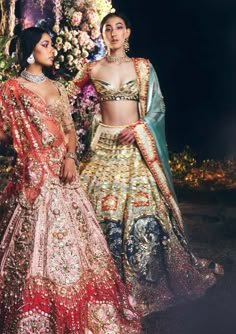 Editor's Note Featuring a 4 piece bridal lehenga set in ivory tulle appliquéd with red, teal, & blue silks. This lehenga is embroidered with gold metal 3d embellishments, precious stones, and reflective beads. It is paired with a half sleeved appliquéd blouse embroidered gold metal embellishments and precious stones. This look is completed with 2 dupattas in teal organza tissue and red tulle Color: Multicolor Fabric: Silk, tulle, organza tissue Sleeve type: Half Neckline: Sweetheart Embroidery d Lehenga Color Combinations, New Lehenga, Nikkah Dress, Metal Embellishments, Bridal Lehenga Red, Regal Design, Silk Tulle, Tarun Tahiliani, Indian Bridal Outfits