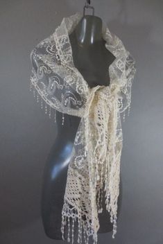 Sheer Cream Lace and Embroidery Shawl, Ivory Color Wrap, Cotton Crochet and Fringe on End and Edges, Paisley Design, Good Condition. Measurements: 80" long on longest side...not including fringe 13" wide Traditional Lace Shawl With Lace Trim, Fitted Bohemian Shawl For Wedding, Elegant Embroidered Lace Fabric, Fitted Embroidered Cream Lace, Fitted Cream Embroidered Lace, Cream Embroidered Fitted Lace, Elegant Cream Embroidered Fabric And Notions, Vintage Fitted Shawl For Wedding, Fitted Vintage Shawl For Wedding