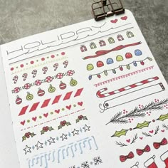 a clipboard with christmas stickers on it