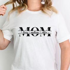 Free Shipping!  This custom tshirt will brighten any mom's day!  Add names for customization.  Lots of colours to choose from.  A perfect gift for any mom on Mother's Day, birthday, or any other occasion.   Custom orders also available.  Message me for details! The design is a high quality direct to garment print.  This ensures vibrant colours and long lasting designs.  The personalization is added with black vinyl. Shirt colour may vary slightly due to lighting and monitor settings. ♡ Sizing: Please note that this t-shirt comes in unisex sizes! Women may want to order a size down if you want a more snug fit. Inclusive sizing S to 3XL.  Please refer to the size guide photo for more information. ♡ Details: Ideal for any situation, a unisex Bella and Canvas heavy blend crewneck sweatshirt is Personalized Name Print T-shirt For Mother's Day, Personalized Mother's Day T-shirt With Custom Text, Custom Text T-shirt For Mother's Day Personalized Gift, Mother's Day Personalized Name Print T-shirt, Custom Text T-shirt For Mother's Day Gift, White T-shirt For Mother's Day Gift, Custom Text Top For Mother's Day Gift, Personalized Graphic Tee For Mother's Day, Customizable T-shirt For Mother's Day