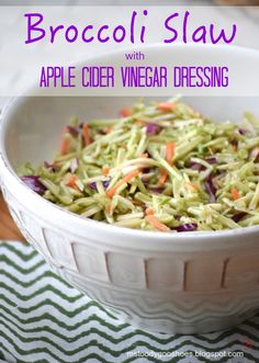 broccoli slaw with apple cider vinegar dressing in a large white bowl