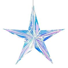 a blue and white star ornament hanging from a string on a white background