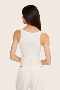 Stay stylish and comfortable with the Ribbed Modal Body Tank in Blanc. This fitted full-length tank top features a rounded square front neckline and full coverage back, crafted from luxurious ribbed modal fabric. Seamless Modal Tank Top, Fitted Ribbed Tank Top For Loungewear, Summer Ribbed Modal Tank Top, Ribbed Modal Tank Top For Summer, Fitted Ribbed Camisole For Loungewear, Stretch Ribbed Modal Tank Top, Fitted Ribbed Tank Top With Scoop Neck, Fitted Ribbed Camisole With Scoop Neck, Fitted Ribbed Scoop Neck Tank Top