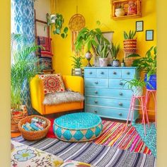 a living room filled with lots of colorful furniture and plants on top of the walls