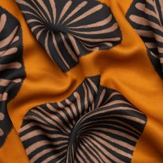 an orange and black fabric with zebra print