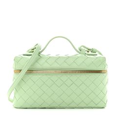 This is an authentic BOTTEGA VENETA Calfskin Intrecciato Bang Bang Vanity Case in Fresh Mint. This stylish handbag is beautifully crafted of woven calfskin leather in light green. The bag features a leather top handle, an adjustable shoulder strap, and gold hardware. The wrap around zipper opens to a smooth leather interior with a pocket. Luxury Travel Box Bag With Braided Handles, Luxury Green Baguette Bag For Travel, Green Luxury Baguette Bag For Travel, Elegant Travel Box Bag With Braided Handles, Luxury Top Handle Box Bag With Braided Handles, Luxury Box Bag With Braided Handles, Luxury Satchel Box Bag With Braided Handles, Luxury Rectangular Box Bag With Braided Handles, Luxury Box Bag With Braided Top Handle