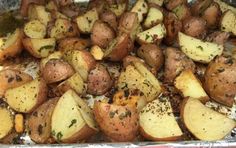 cooked potatoes with herbs and seasoning on tin foil