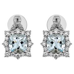 This collection features an array of Aquamarines with an icy blue hue that is as cool as it gets! Accented with Diamonds these Stud Earrings are made in White Gold and present a classic yet elegant look. Aquamarine Stud Earrings in 18Karat White Gold with White Diamond. Aquamarine: 2.39 carat, 7X7mm size, Cushion shape White Diamond: 0.255 carat, 1.60mm size, round shape, G color, VS clarity. White Diamond: 0.565 carat, 2.00mm size, round shape, G color, VS clarity. White Diamond: 0.098 carat, 1.00mm size, round shape, G color, VS clarity. Gold: 5.128g, 18Karat white Gold. Butterfly Pin and Push Back. E543 Aquamarine Studs, Butterfly Pin, Naha, Icy Blue, Aqua Marine, Gold Butterfly, Blue Hues, Jewelry Earrings Studs, White Diamond