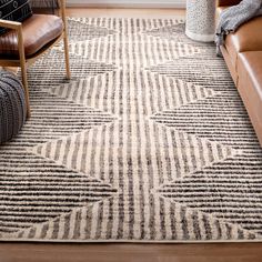 a living room area with leather furniture and rugs