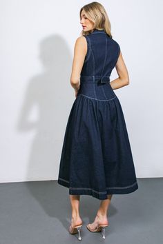 This exquisite denim midi dress boasts a lapel collar, sleeveless design, button front closure, self-tie belt, and a flattering drop waist.Details:Self : 70% Cotton 28% Polyester 2% SpandexSize & Fit- Model is 5`10" And Wearing Size Small- Measurements Taken From Size Small- Approx. Length: 50" Dark Denim Dress, Conservative Dress, Waist Tie Dress, Long Denim Dress, Casual Denim Dress, Teacher Dresses, Denim Midi Dress, Drop Waist Dress, Flying Tomato