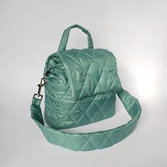 Green mint bucket bag quilted with detachable strap. Handmade green nylon bucket shoulder bag for women. Height - 23 cm  ( 9,05 " ) Width - 31 cm   ( 12,20 " ) Depth - 9 cm ( 3,54 " ) Strap  - 75 cm  ( 29,53 " ) Green mint bucket bag made of quilted nylon fabric. Green shoulder bag has cotton lining, 1 pocket inside, detachable strap. The mint green bag fastens with 1 magnetic button. Green mini bag quilted for women. Mint mini shoulder bag quilted drawstring. Beautiful small handbag light green Green Quilted Shoulder Bag For Travel, Quilted Green Shoulder Bag For Travel, Green Quilted Crossbody Shoulder Bag, Trendy Green Quilted Shoulder Bag, Green Nylon Bag With Detachable Strap, Green Quilted Bag For Daily Use, Green Quilted Shoulder Bag, Green Bucket Bag With Zipper Closure, Green Bucket Bag With Detachable Strap For Travel