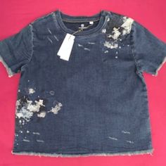 Size: L; Excellent Condition . Brand New With Tags. Features: Crew Neck, Short Sleeve, Indigo Denim, Embroidered Detail, Splattered Paint Detail, Fraying At The Sleeve And Hem, 91% Cotton,7% Polyester, 2% Spandex, Machine Washable. (K01) Indigo Short Sleeve Cotton Denim Top, Indigo Short Sleeve Denim Top, Indigo Cotton Denim Top With Short Sleeves, Blue Short Sleeve Top With Frayed Hem, Washed Denim Blue Short Sleeve Tops, Dark Wash Denim Short Sleeve Top, Dark Wash Cotton Short Sleeve Top, Blue Cotton Short Sleeve Denim Top, Blue Short Sleeve Cotton Denim Top