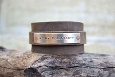 Its a wrap cuff ~ The smaller strip wraps around the larger cuff and fastens with a post and hole closure. Adjustable. Add a few words of your choice on a silver metal tag to personalize it - names, dates, a favorite quote, a bible chapter & verse - to personalize for yourself or a gift. A Rustic Stamped Adjustable Cuff Bracelet, Rustic Adjustable Stamped Cuff Bracelet, Rustic Cuff Bracelets As Gift, Adjustable Double Band Cuff Bracelet As Gift, Adjustable Stamped Cuff Bracelet For Everyday, Adjustable Stamped Everyday Cuff Bracelet, Rustic Adjustable Cuff Bracelet, Adjustable Stamped Meaningful Cuff Bracelet, Adjustable Hand Stamped Cuff Bracelet For Everyday