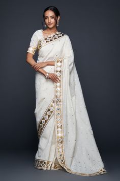 Off-white jamdani saree with gota applique embellishment in barfi pattern. - Aza Fashions White Chanderi Pre-draped Saree With Zari Work, White Cotton Silk Pre-draped Saree With Zari Work, Traditional Off White Chanderi Pre-draped Saree, Traditional Cotton Silk Saree With Gota Work, Off White Chanderi Traditional Wear With Gota Work, Cotton Silk Saree With Mirror Work For Eid, Eid Cotton Silk Saree With Mirror Work, White Cotton Silk Pre-draped Saree For Festivals, Festive Off-white Cotton Silk Traditional Wear