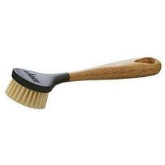 a wooden brush with black bristles on it