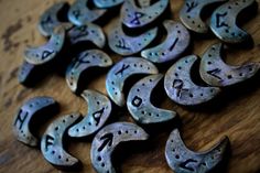 old metal letters are arranged on a wooden surface