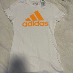 New With Tags White Adidas Sporty T-shirt, Adidas White Sporty T-shirt, White Adidas Logo T-shirt For Sports, White Adidas Logo Sports T-shirt, White Adidas Graphic Tee, White Adidas Logo Crew Neck T-shirt, White Adidas Logo Casual Tops, White Adidas Graphic Tee With Logo, White Casual Adidas Logo Tops