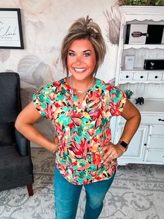 Some tops make a subtle statement. This isn’t one of them. Its notched V-neck and short sleeves keep things chic. Pair this top with your favorite distressed denim for a laid-back boho vibe or a structured blazer for a splash of color in the office. However you style it, one thing’s for sure: in this scene-stealing top, you’ll be the center of attention. After all, when you’ve got a silhouette this flattering, the only option is to make a memorable impression. Figure it out? This top already has Fitted Multicolor Print Short Sleeve Top, Multicolor Print Bold Short Sleeve Tops, Multicolor Vibrant Print Short Sleeve Shirt, Fitted Multicolor Print T-shirt With Short Sleeves, Multicolor Abstract Print Short Sleeve Top, Boho Vibe, Figure It Out, Distressed Denim, Color Splash