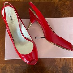 Authentic Miumiu Brand New, Never Worn Tried Indoors Only Sling Back Peep Toe Red Patent Leather Upper Red And Gold, Slim, Cone Heel Made In Italy Dust Bags And Box Included Elegant Miu Miu Slingback Pumps With Pointed Toe, Miu Miu Leather Slingback Pumps For Evening, Chic Miu Miu Slingback Pumps With Heel Strap, Elegant Miu Miu Leather Slingback Pumps, Miu Miu Slingback Heels With Heel Strap, Miu Miu Slingback Heels For Formal Occasions, Elegant Miu Miu Slingback Pumps For Evening, Elegant Miu Miu Slingback Heels, Miu Miu Heel Strap Sandals For Spring