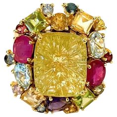 Bochic candy cocktail multi gem ring set in 18k gold & silver Center square cut Citrine 5 carat Multi gem, ruby, topaz, amethyst 4 carats This Ring is from the "Orient" traveling collection are the epitome of elegance and versatility. It offers a perfect blend of day to night and swimwear to evening wear, allowing you to effortlessly transition between different occasions and outfits. Wearing these spectacular oriental-style ring will undoubtedly make you the center of attention. It addw a touch