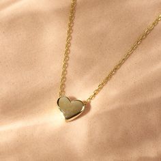 Little Heart Necklace, 14K Solid Gold Necklace, Tiny Heart Necklace, Minimalist, Silver Necklace, Mini Heart Pendant Charm, Plain Heart   FEATURES * Materials (Selectable): Solid Gold (no gold filled or gold plated material) or 925 Sterling Silver (Gold Plated) * Carat: 14K (585 - Real Gold), 925K (Sterling Silver) * Package: Jewelry Box   SHIPPING AS FOLLOWS * Turkey 1-3 days * USA 2-4 days * Europe 1-3 days * Australia 2-6 days 14k Gold Heart Charm Necklace, Gift For Her, Yellow Gold Heart Necklace As Gift For Her, 14k Gold Heart Cut Necklace For Her, 14k Gold Heart Necklace As Gift For Her, Minimalist Heart Necklace With Adjustable Chain, Everyday Heart Cut Necklace With Delicate Chain, Heart Shaped Clavicle Chain Necklace, Heart-shaped Tarnish-resistant Charm Necklace For Her, Tarnish Resistant Heart Cut Necklace For Gift