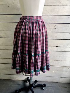 "50s red green plaid peasant skirt 2 tiers with green rick rack trim Full circle skirt Handmade Waist 26\" Length 25\" Width at hem 166\" (measured flat and doubled) Condition - very good vintage" Vintage Green Tiered Skirt, Plaid Tiered Skirt With Ruffles, Plaid Tiered Ruffled Skirt, Plaid Ruffled Cotton Skirt, Plaid Cotton Skirt With Ruffles, Vintage Plaid Cotton Skirt, Hair Grower, Peasant Skirt, Peignoir Sets