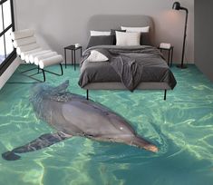 a dolphin swimming in the water next to a bed