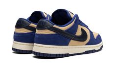 The Women’s Nike Dunk Low “Blue Suede” is a women’s-exclusive colorway of the popular sneaker with a unique arrangement of materials.  The “Blue Suede” Dunk Low features a full-suede construction with tan-colored suede appearing on the perforated toe, mid-panel, and collar, and blue suede on the overlays.  A black leather Swoosh is found on the sides.  A Deep Royal Blue “Nike” logo is embroidered on the heel and printed on the raised black leather tongue patch.  A Sail rubber midsole and blue De Dunk Low Nike, Deep Royal Blue, Blue Suede Shoes, Popular Sneakers, Stadium Goods, Blue Nike, Suede Material, Nike Dunk Low, Dunk Low